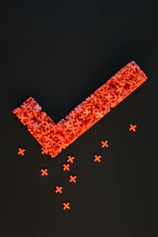 a group of red crosses on a black surface