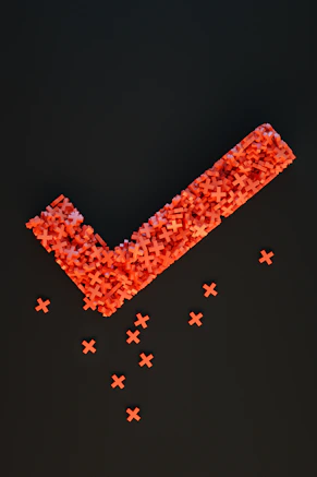 a group of red crosses on a black surface