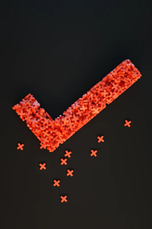 a group of red crosses on a black surface