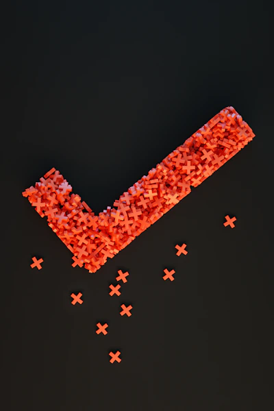 a group of red crosses on a black surface