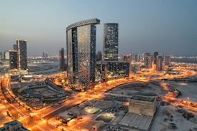 a city with a lot of tall buildings at night