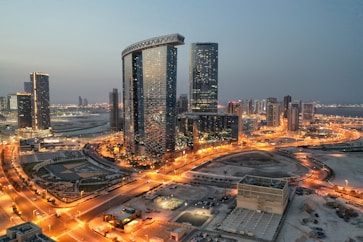 a city with a lot of tall buildings at night