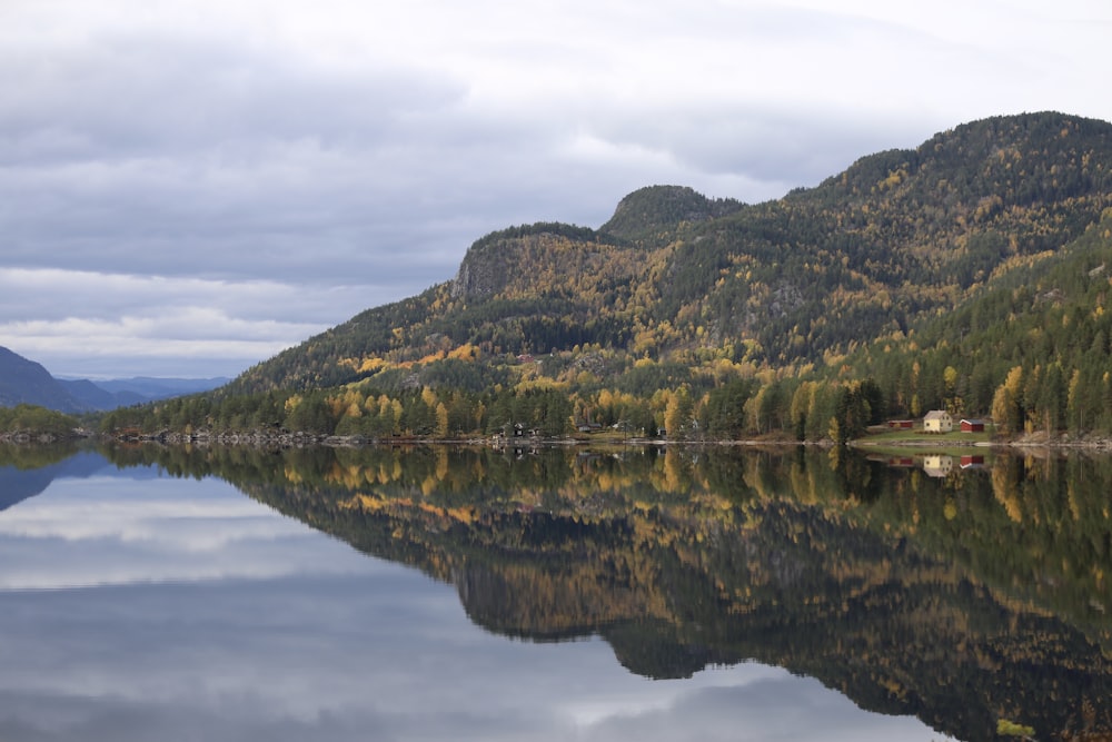 a lake surrounded by mountains and trees