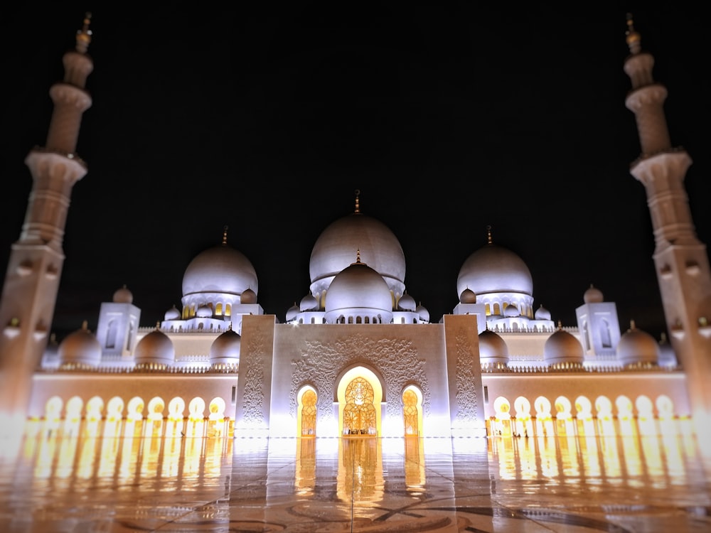 a large white building with many arches and domes