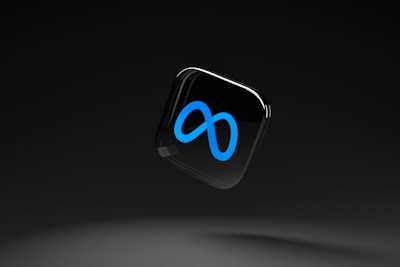 A sleek, black background with a floating glossy black square featuring a prominent blue infinity symbol.