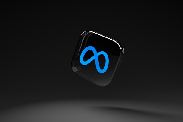 A sleek, black background with a floating glossy black square featuring a prominent blue infinity symbol.