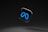 A sleek, black background with a floating glossy black square featuring a prominent blue infinity symbol.