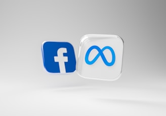 a white and blue square with a blue and white facebook logo