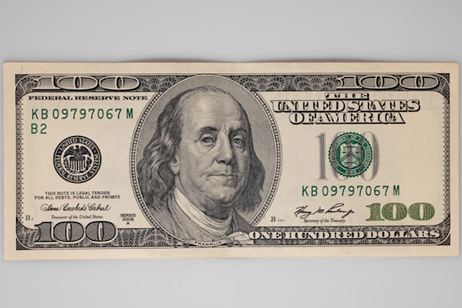 a one hundred dollar bill with a picture of a man's face on it