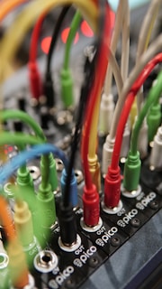 a close up of a computer board with many wires