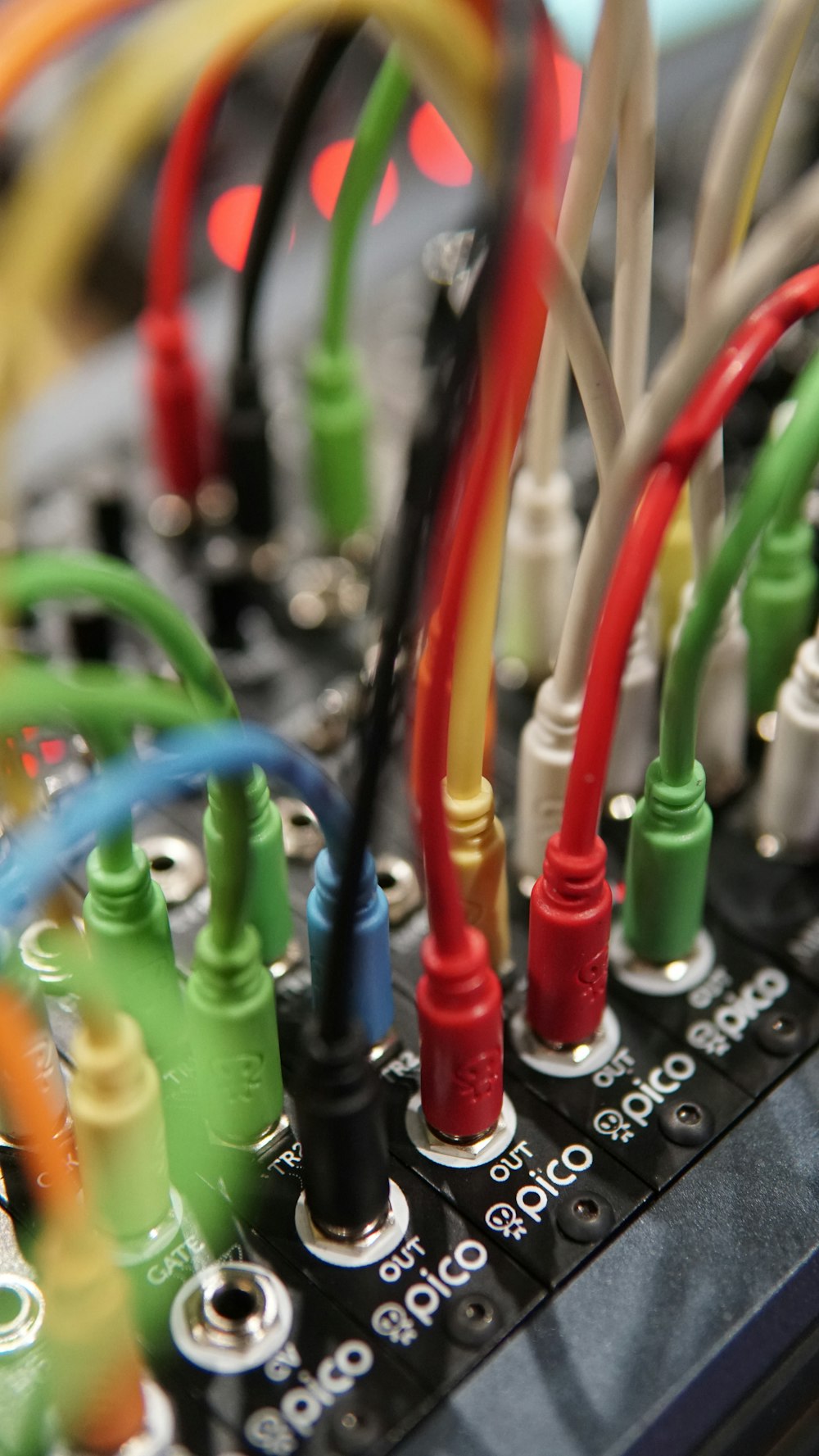 a close up of a computer board with many wires