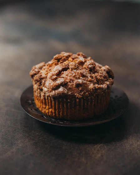 a muffin sitting on a plate on a table