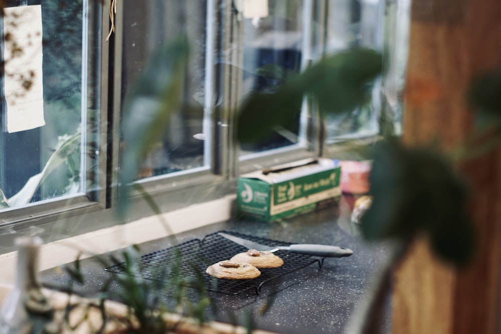 a couple of doughnuts sitting on top of a grill