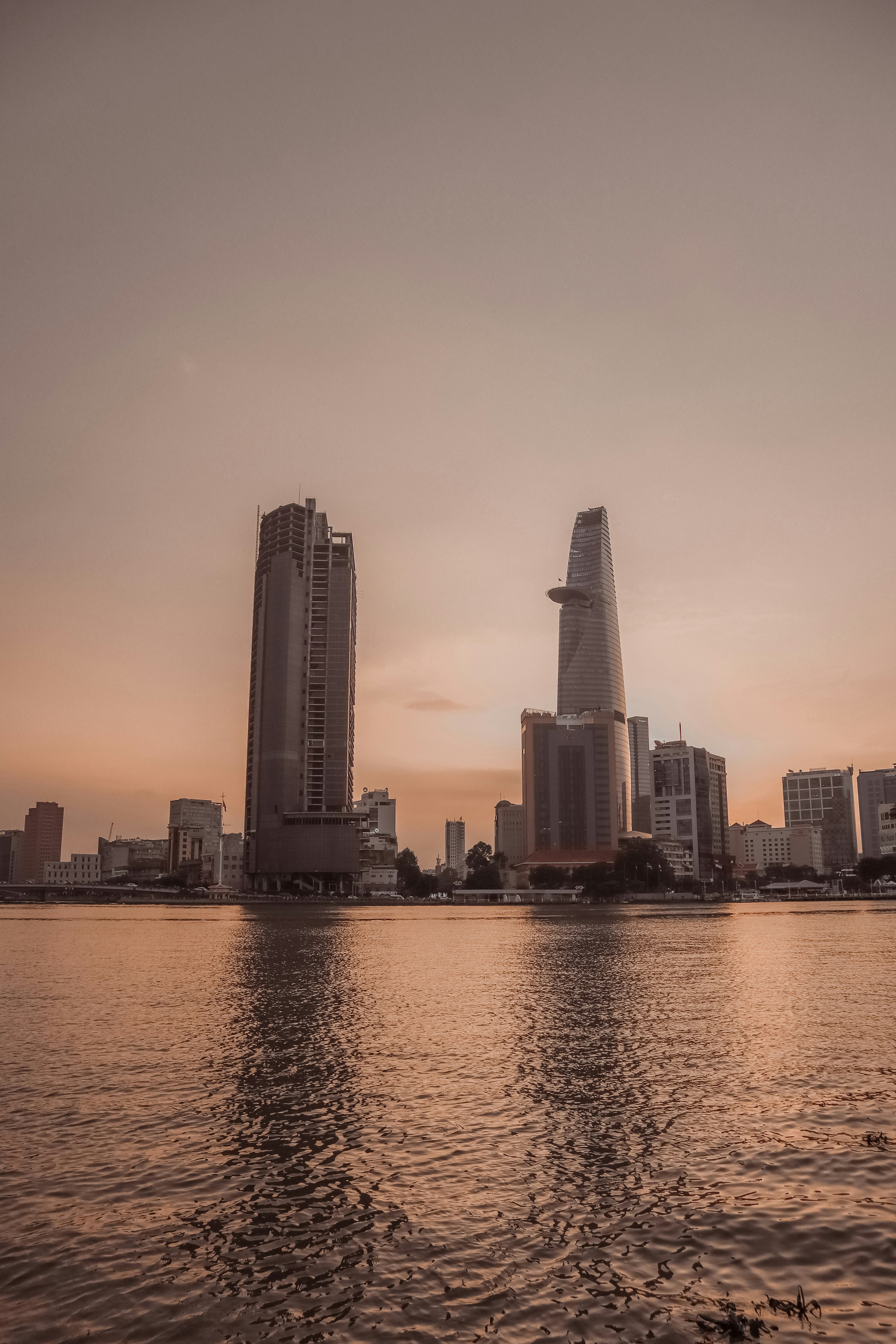 a body of water with buildings in the background