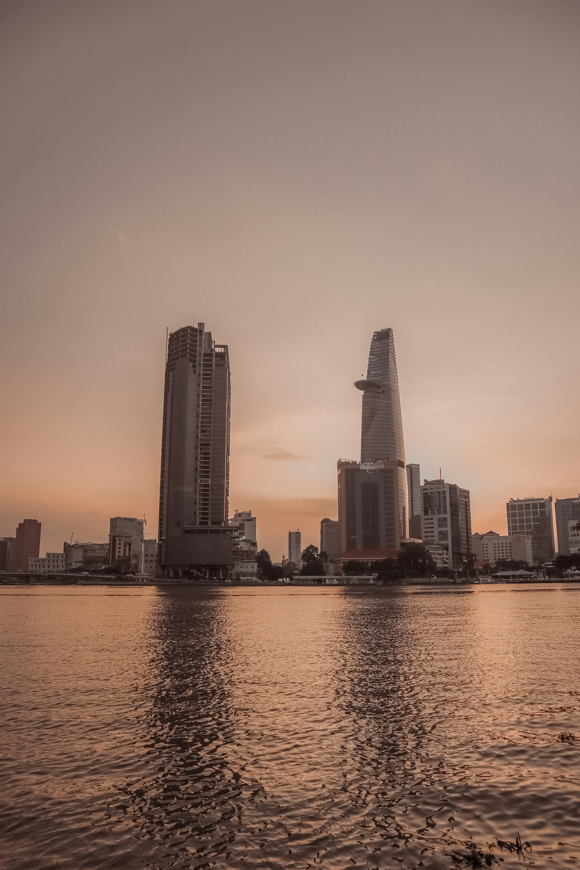a body of water with buildings in the background