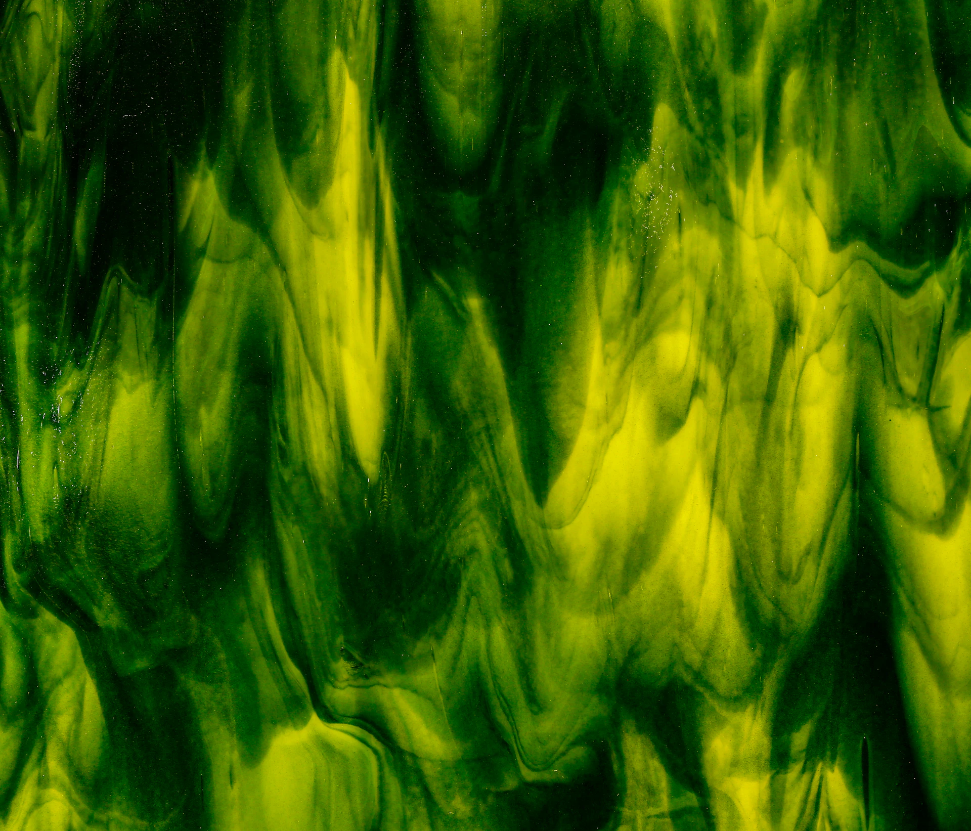 a close up of a green and black substance