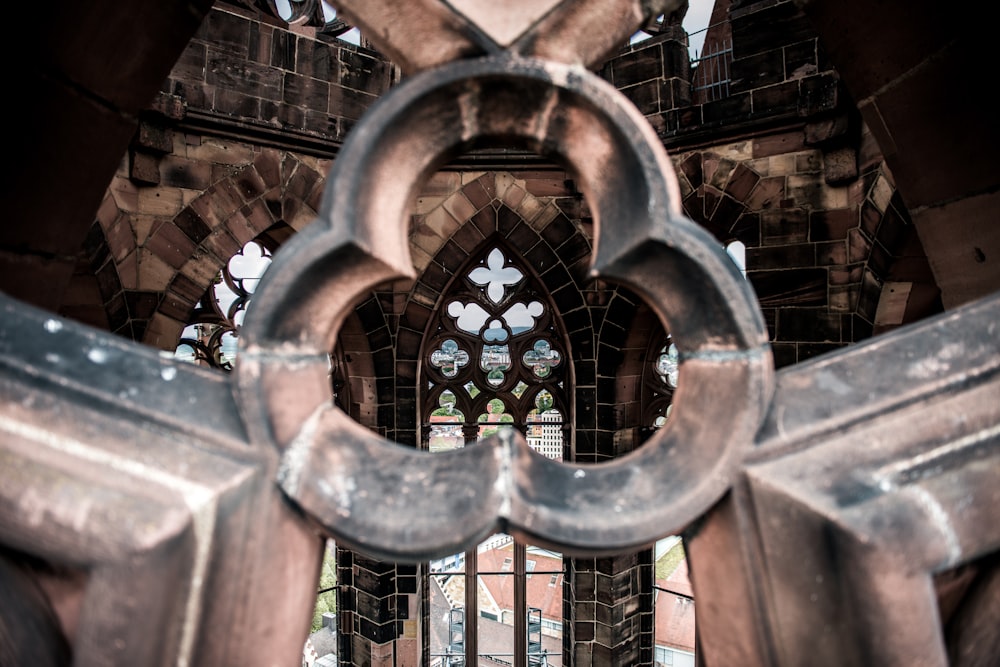 a large metal gate with a window in the background