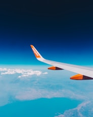 a view of the wing of an airplane in the sky