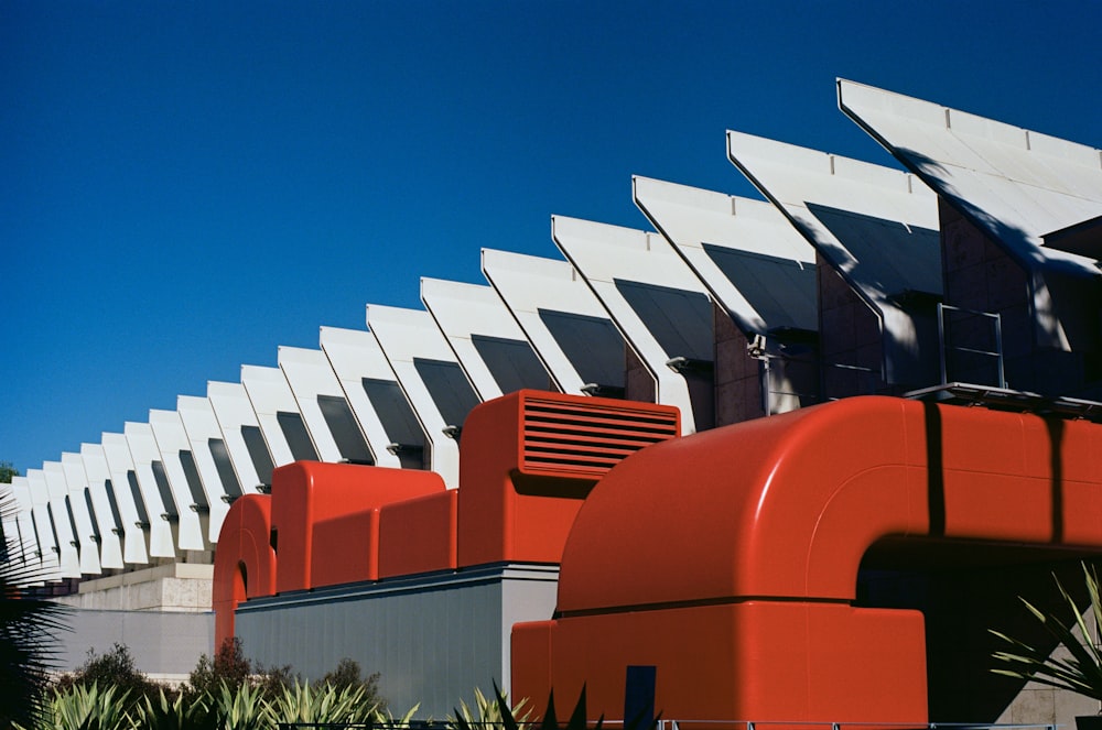 a row of red and white buildings next to each other