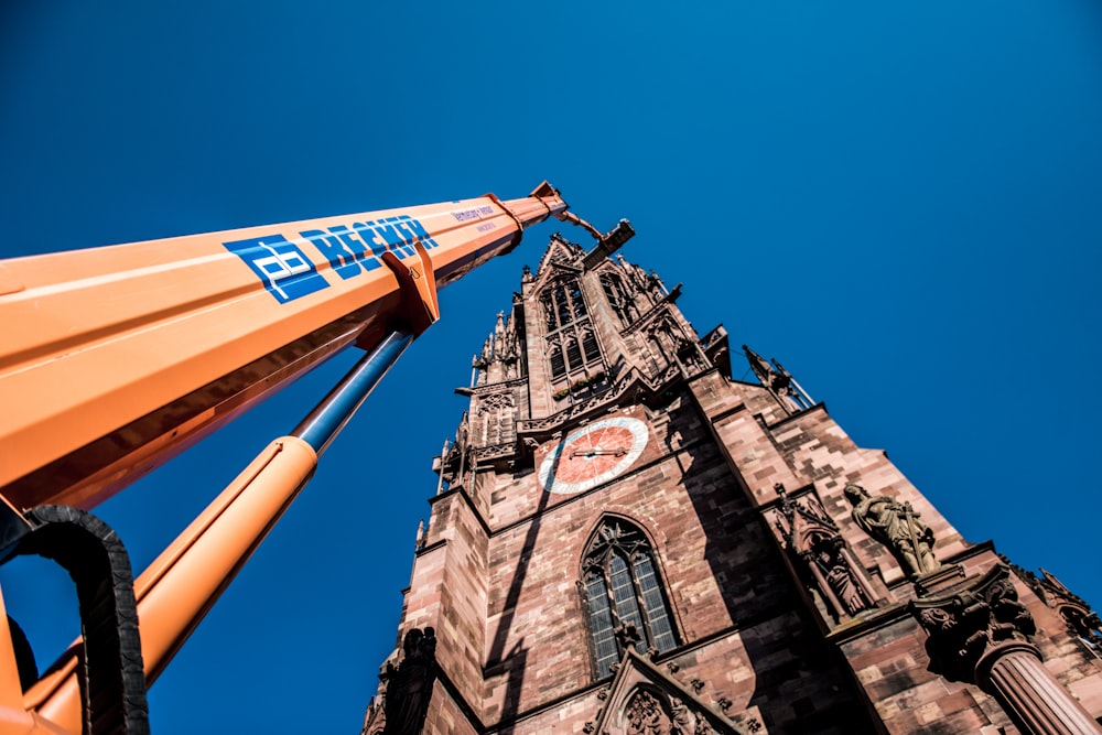 a very tall tower with a clock on it's side