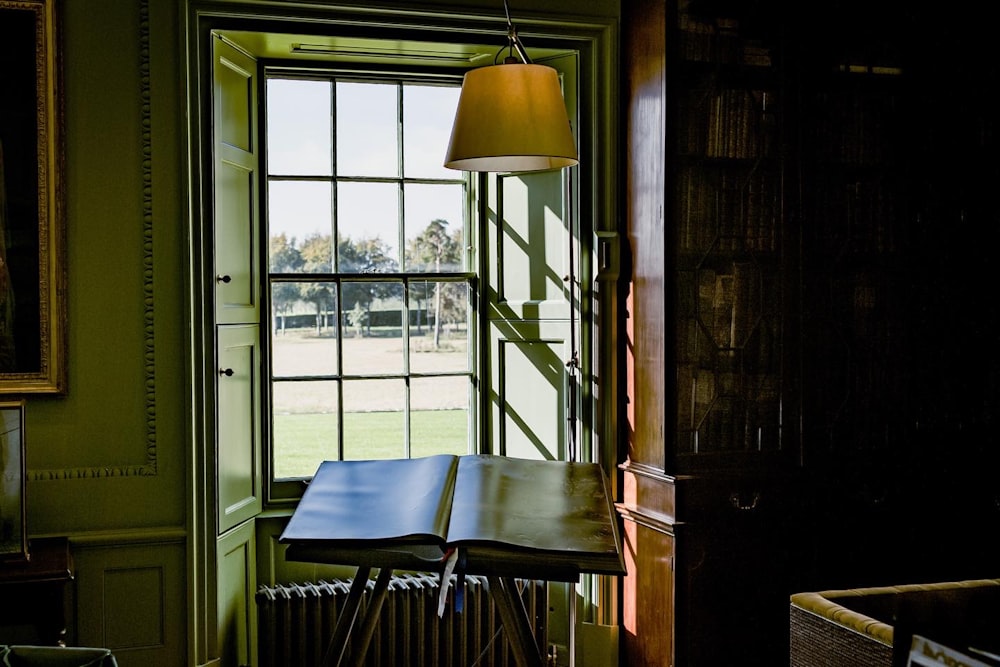 a room with a table and a lamp in it