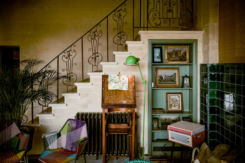 a room filled with furniture and a staircase