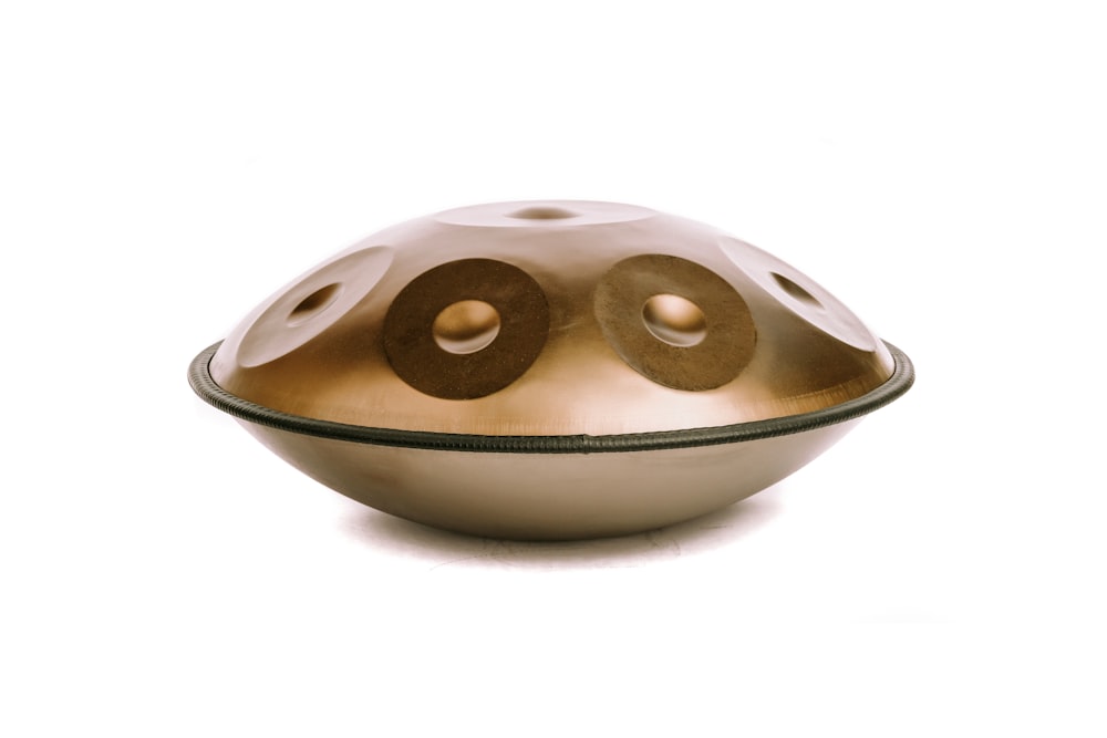 a white bowl with two brown circles on it