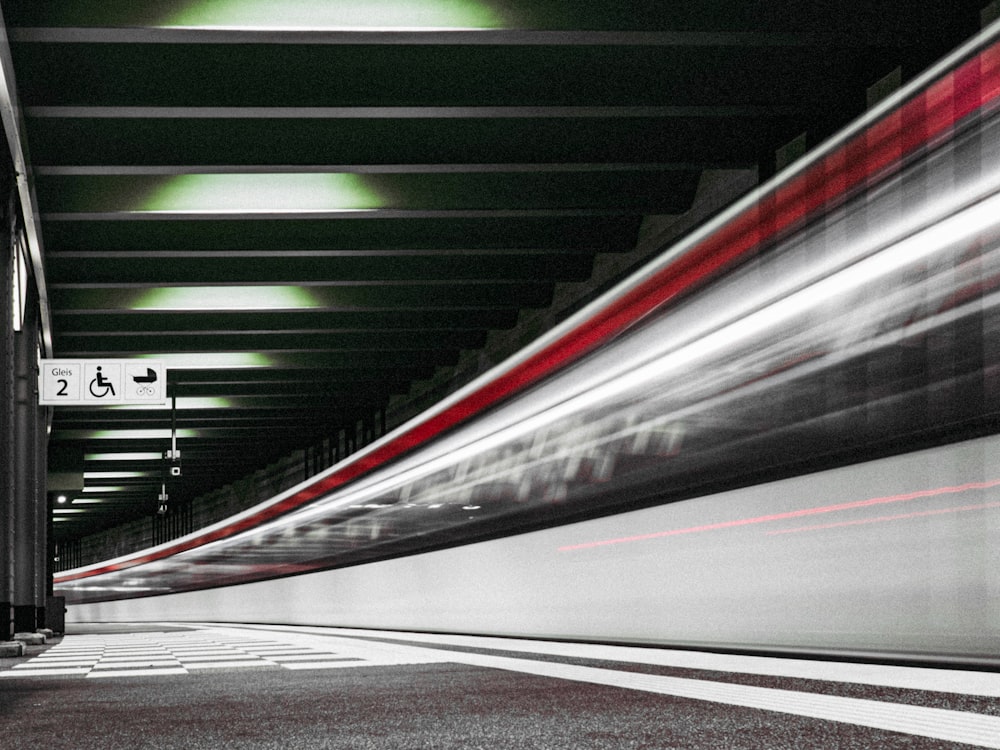 a long exposure photo of a train going through a tunnel