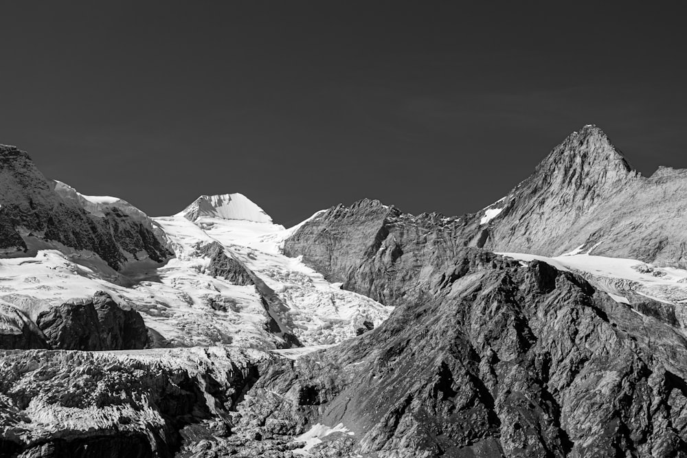 a black and white photo of a mountain range