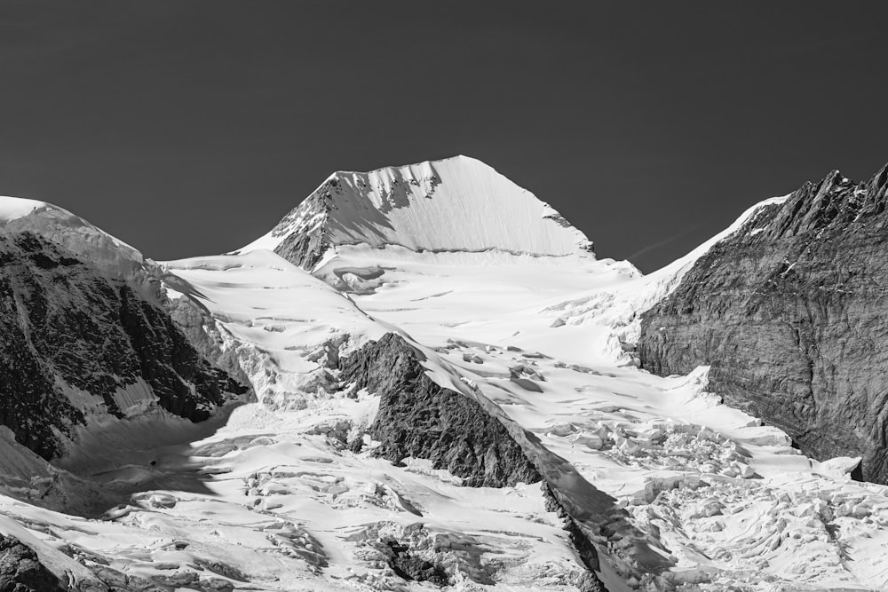 a black and white photo of a mountain range