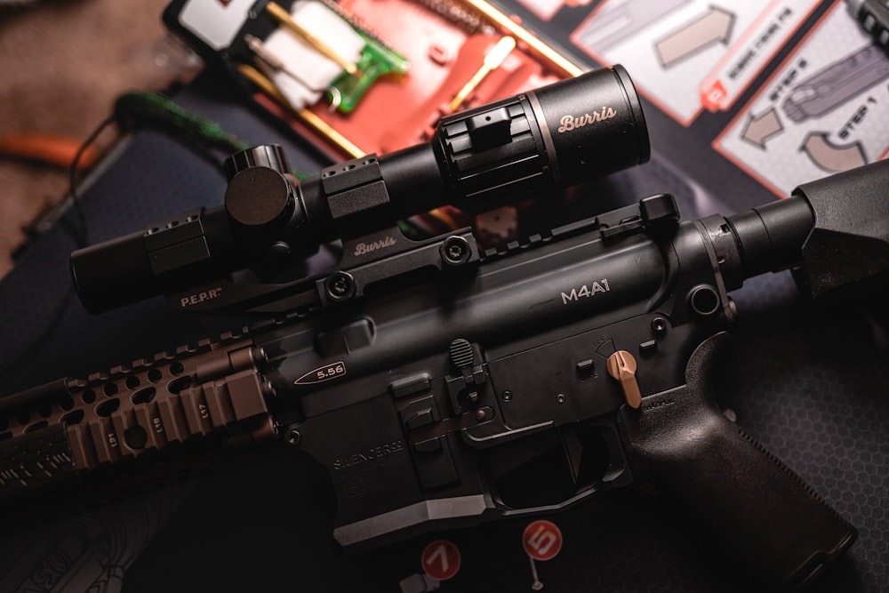 a close up of a rifle on a table