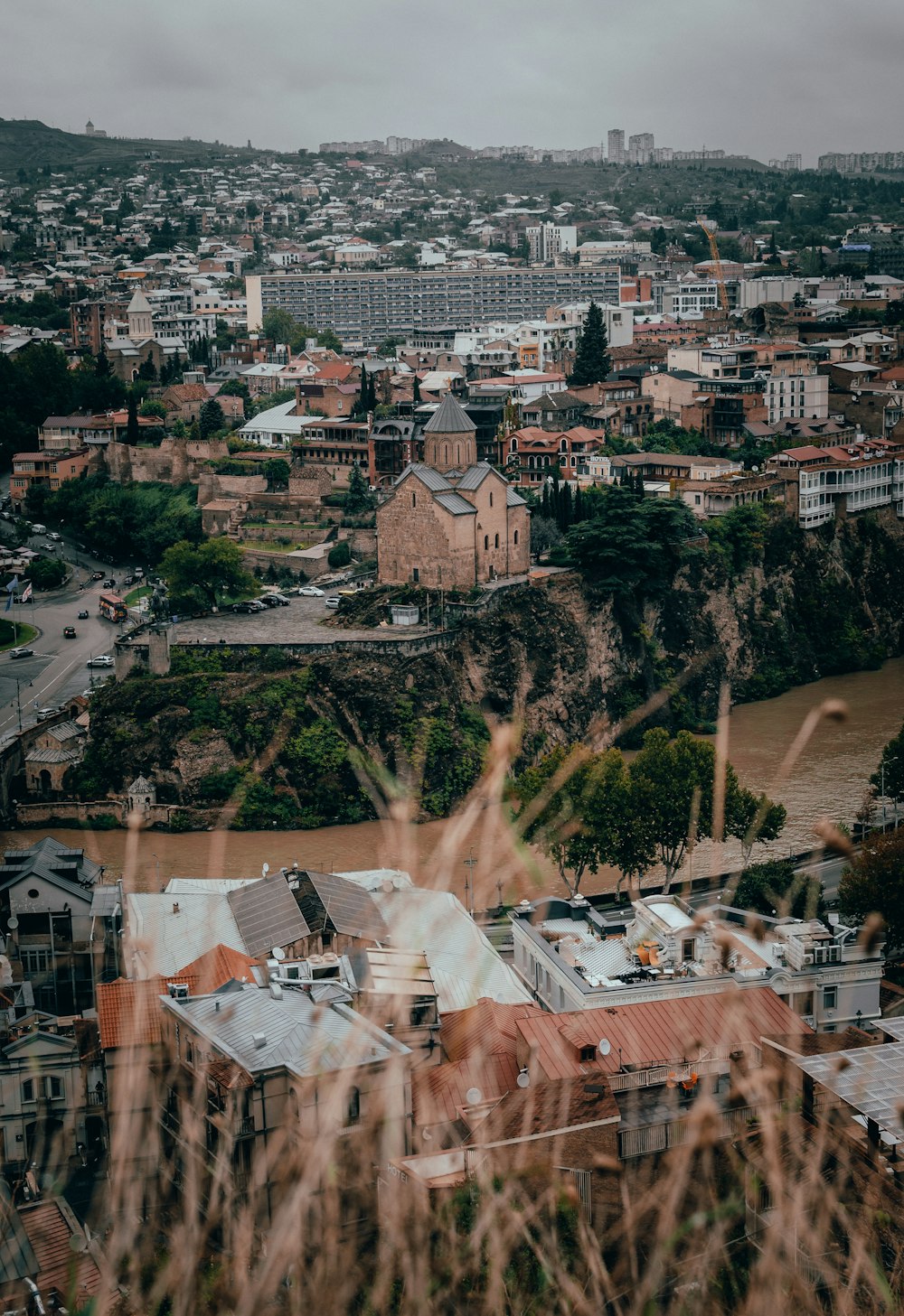 a view of a city from the top of a hill