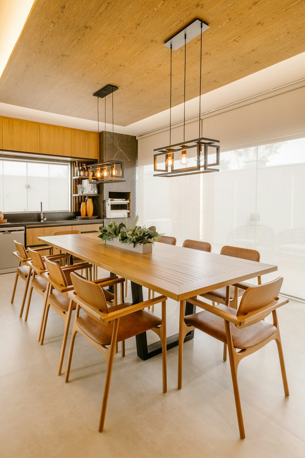 a dining room with a table and chairs