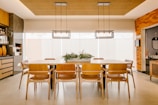 a kitchen with a dining room table