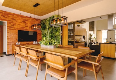 a dining room with a wooden table and chairs