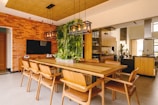 a dining room with a wooden table and chairs