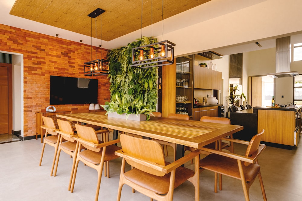 a dining room with a wooden table and chairs