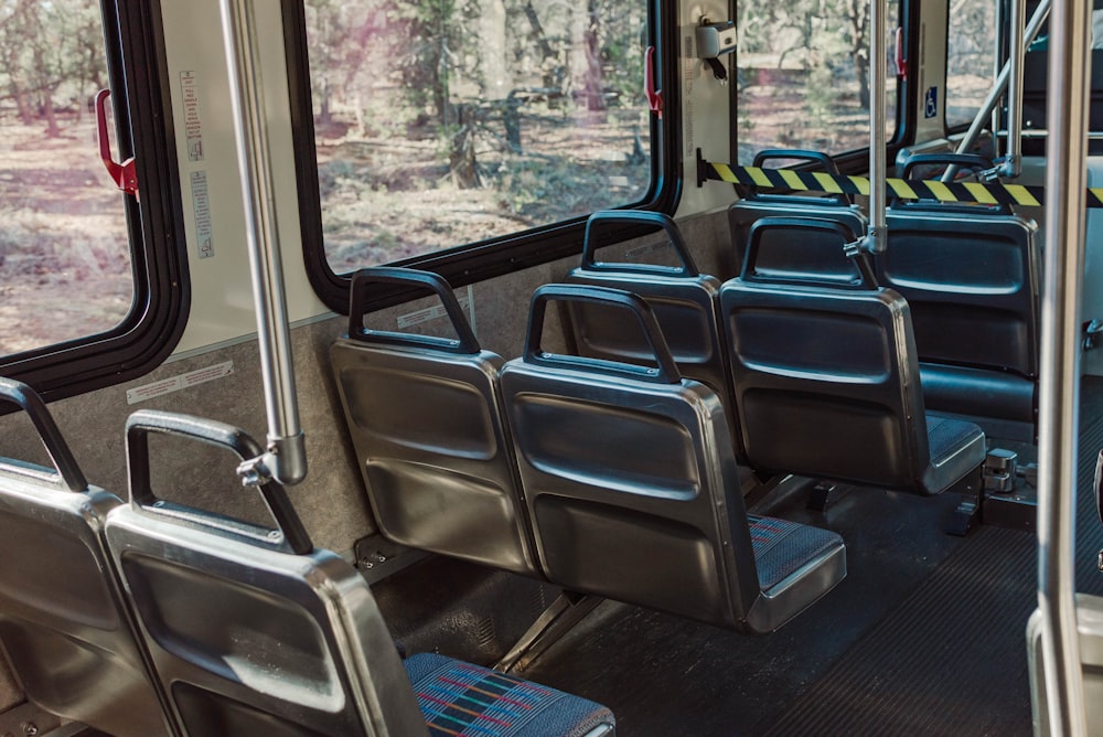 a row of empty seats on a public transit bus