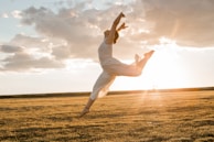 a person in a field doing a trick