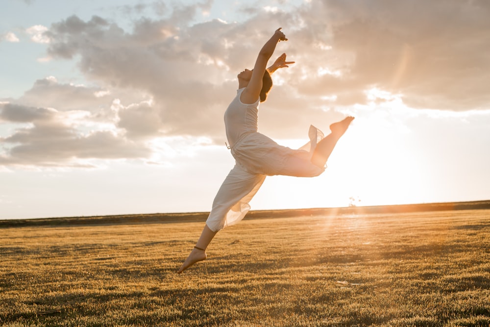 a person in a field doing a trick