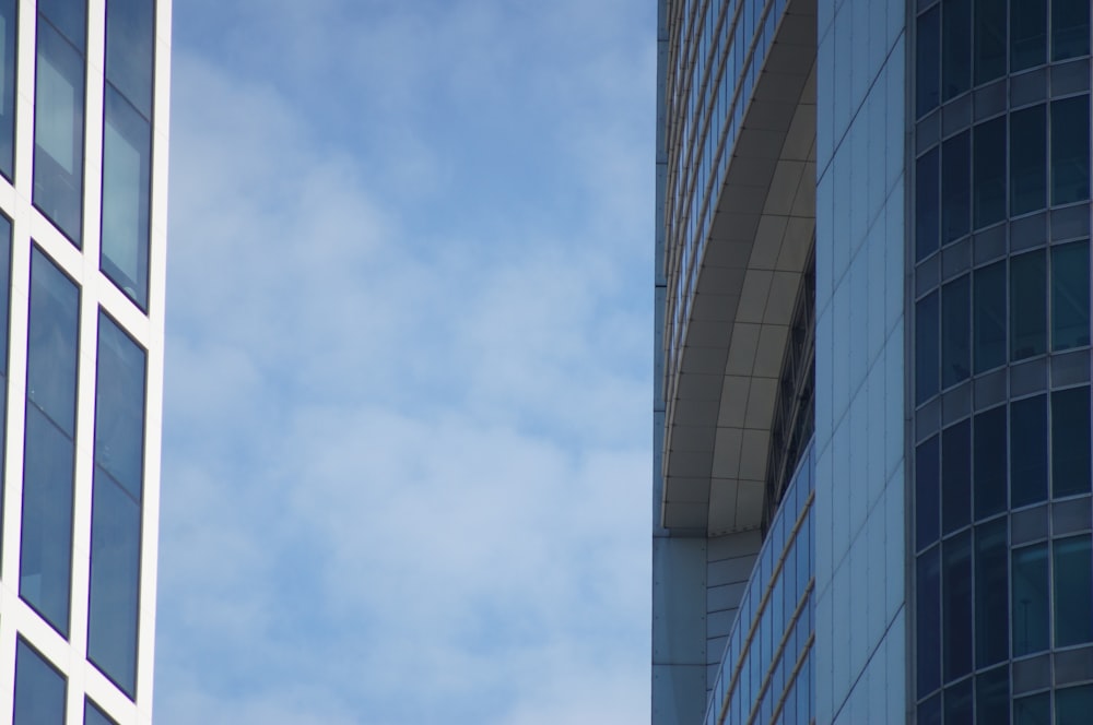 a tall building next to a very tall building