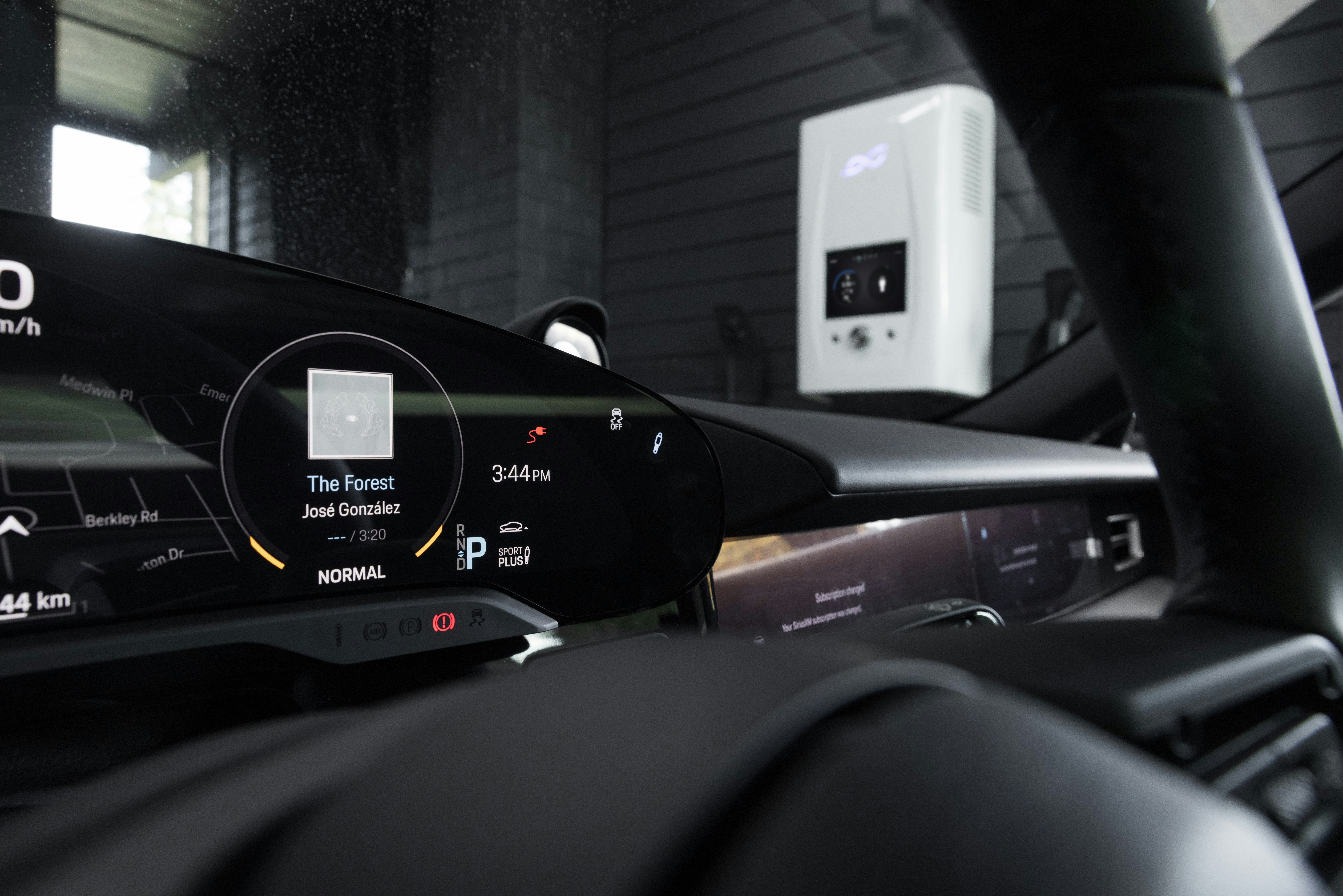 View of dcbel r16 smart home energy station from the inside of a Porsche Taycan.