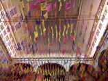 Hotel lobby decorated with colorful Somos Barrio Cup banners.