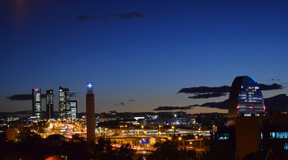 a view of a city at night from a hill