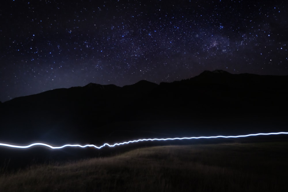 a long exposure photo of the night sky