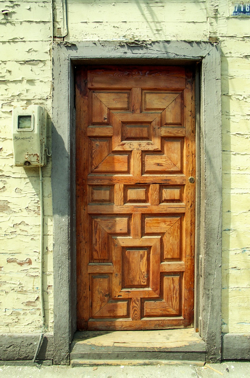 a wooden door on a brick building