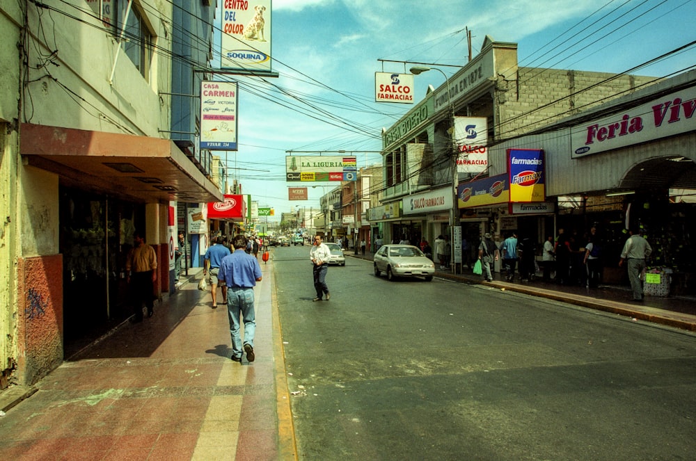 a man riding a skateboard down the middle of a street