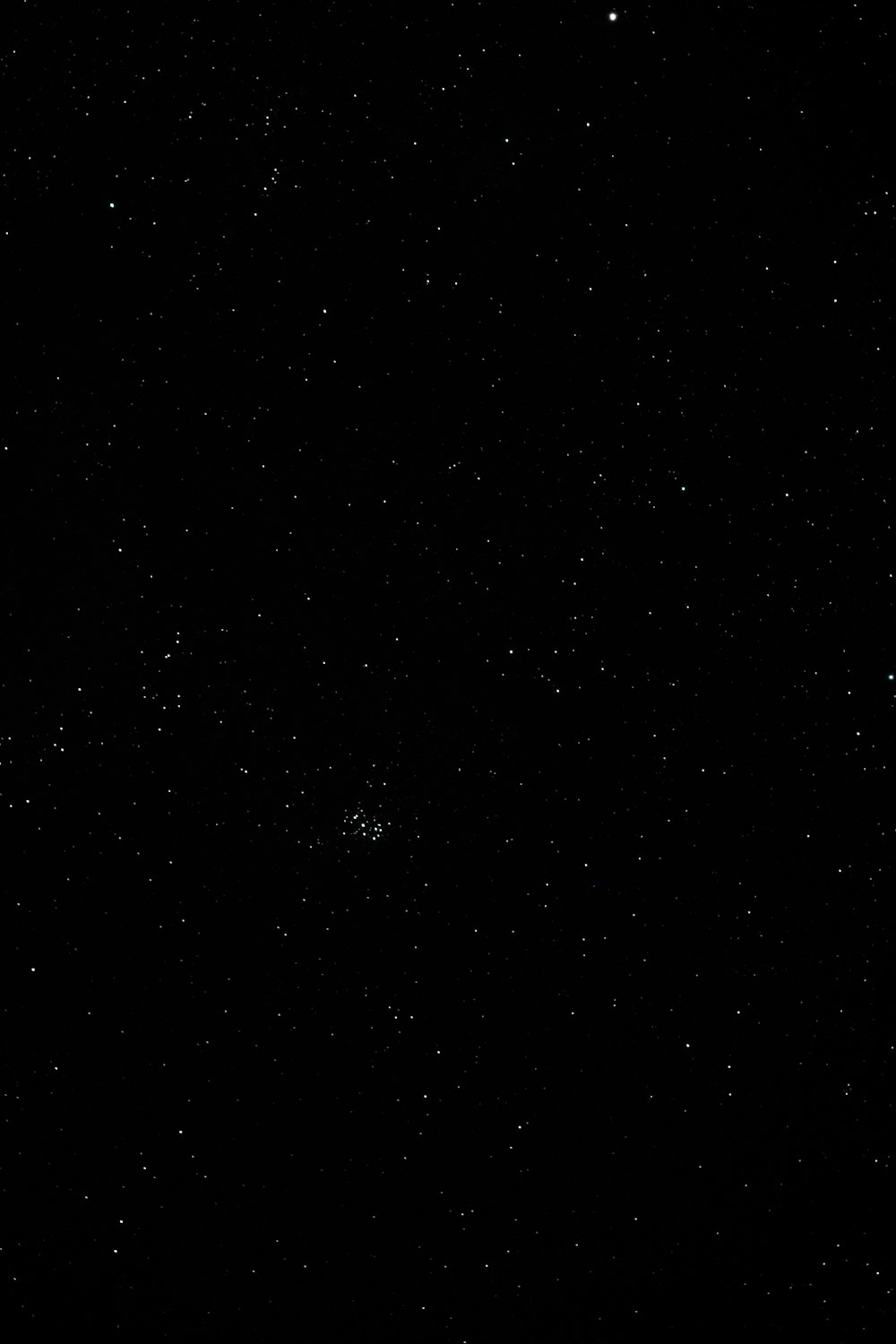 a black background with stars and a plane in the sky