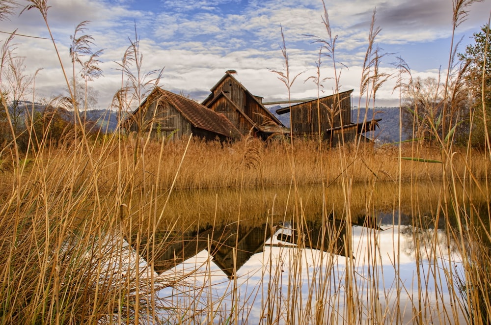 an old abandoned house sitting in the middle of a field