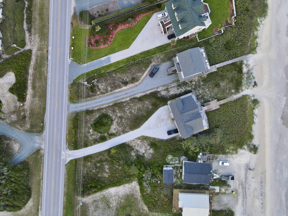 an aerial view of a house and a road